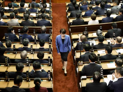 Sanae Takaichi, leader of the ruling Liberal Democratic Party, walks after casting a vote in an election to choose Japan's next prime minister at the Lower House of Parliament in Tokyo, Japan, October 21, 2025. Kyodo/via REUTERS ATTENTION EDITORS - THIS IMAGE WAS PROVIDED BY A THIRD PARTY. EDITORIAL USE ONLY. MANDATORY CREDIT. JAPAN OUT. NO COMMERCIAL OR EDITORIAL SALES IN JAPAN.