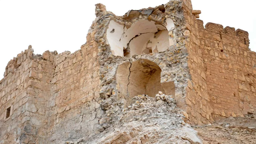 This photo released by the Syrian official news agency SANA, shows damage to the Palmyra citadel following fighting between Government forces and Islamic State group militants in Palmyra, Syria, Sunday, March 27, 2016. Syrian state media and an opposition monitoring group say government forces backed by Russian airstrikes have driven Islamic State fighters from the historic central town of Palmyra, held by the extremists since May. (SANA via AP)