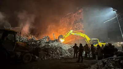 Rescuers work at the site of an apartment building hit by a Russian air strike, amid Russia's attack on Ukraine, in Kharkiv, Ukraine January 2, 2026. REUTERS/Sofia Gatilova