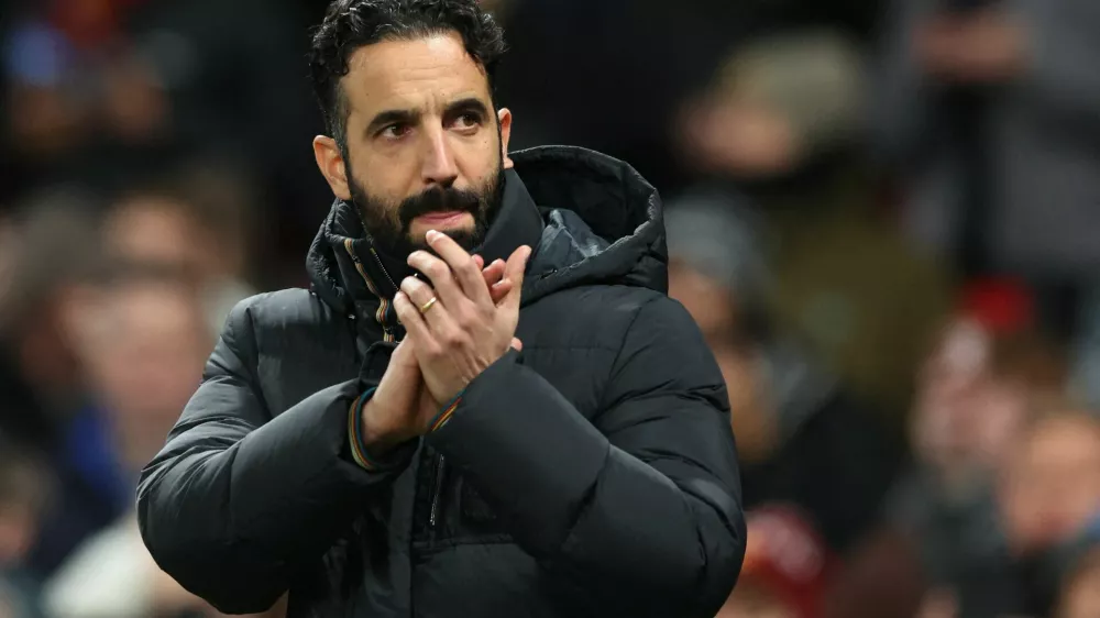 FILE PHOTO: Soccer Football - Premier League - Manchester United v West Ham United - Old Trafford, Manchester, Britain - December 4, 2025 Manchester United manager Ruben Amorim applauds fans before the match REUTERS/Scott Heppell EDITORIAL USE ONLY. NO USE WITH UNAUTHORIZED AUDIO, VIDEO, DATA, FIXTURE LISTS, CLUB/LEAGUE LOGOS OR 'LIVE' SERVICES. ONLINE IN-MATCH USE LIMITED TO 120 IMAGES, NO VIDEO EMULATION. NO USE IN BETTING, GAMES OR SINGLE CLUB/LEAGUE/PLAYER PUBLICATIONS. PLEASE CONTACT YOUR ACCOUNT REPRESENTATIVE FOR FURTHER DETAILS../File Photo