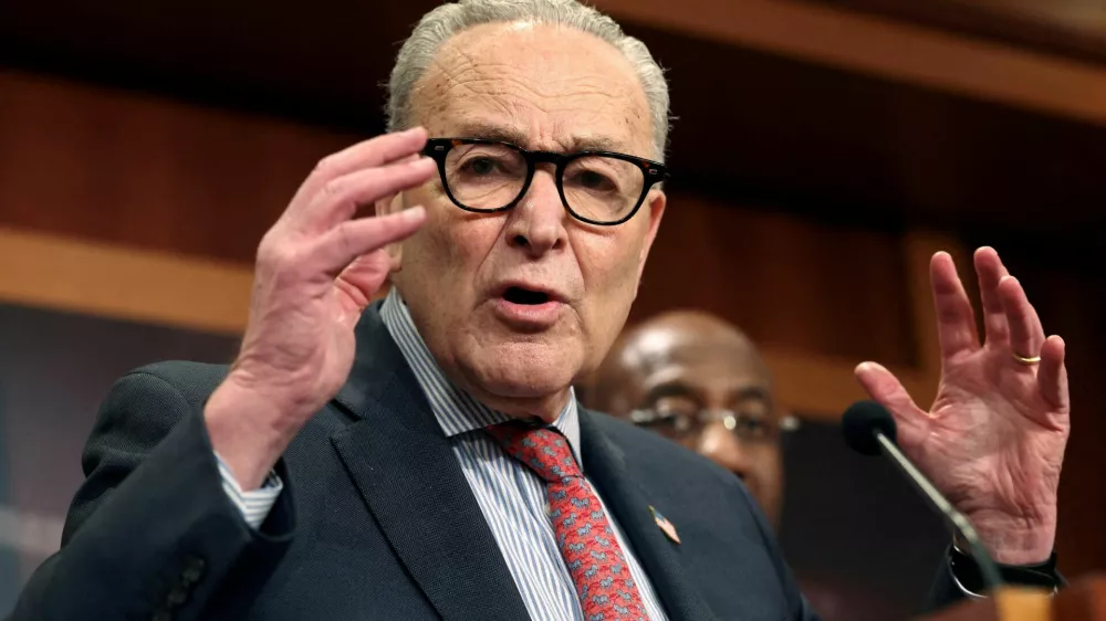 FILE PHOTO: U.S. Senate Democratic Leader Chuck Schumer speaks following Senate votes on competing healthcare plans, at the U.S. Capitol in Washington, D.C., U.S., December 11, 2025. REUTERS/Kevin Lamarque/File Photo