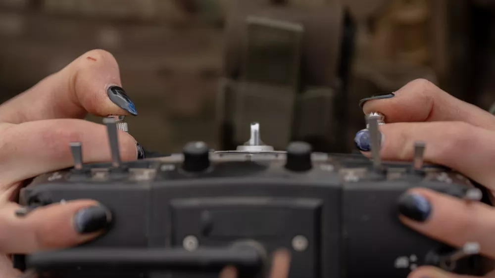Monka, a Ukrainian FPV drone operator from the third assault brigade, pilots an FPV drone during a demonstration for The Associated Press, Wednesday, Nov. 5, 2025, in Kharkiv Oblast, Ukraine. (AP Photo/Julia Demaree Nikhinson)