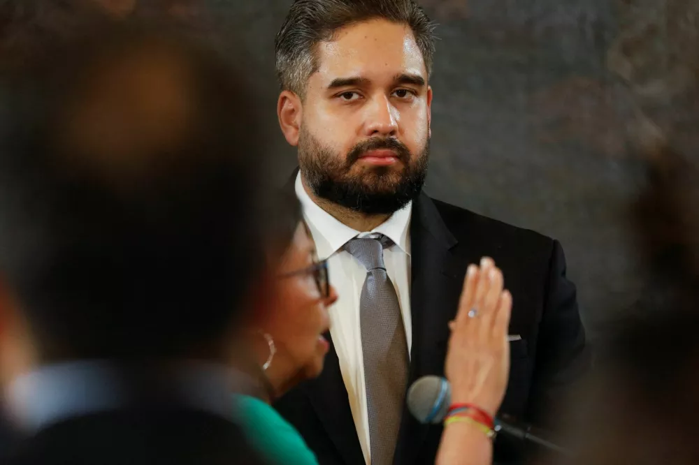 Vice President Delcy Rodriguez is sworn in as Venezuela's interim president while Nicolas Maduro Guerra, son of ousted president Nicolas Maduro looks on, at the National Assembly, after the U.S. launched a strike on the country and captured Maduro and his wife Cilia Flores, in Caracas, Venezuela, January 5, 2026. REUTERS/Leonardo Fernandez Viloria