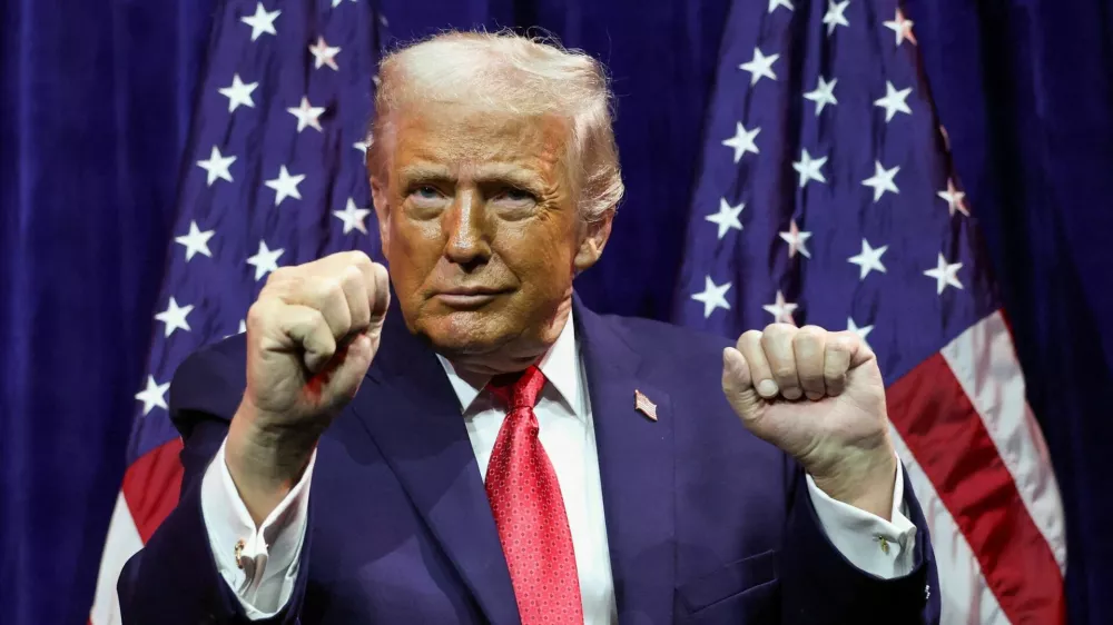 FILE PHOTO: U.S. President Donald Trump gestures as he addresses House Republicans at their annual issues conference retreat, at the Kennedy Center, renamed the Trump-Kennedy Center by the Trump-appointed board of directors, in Washington, D.C., U.S., January 6, 2026. REUTERS/Kevin Lamarque/File Photo