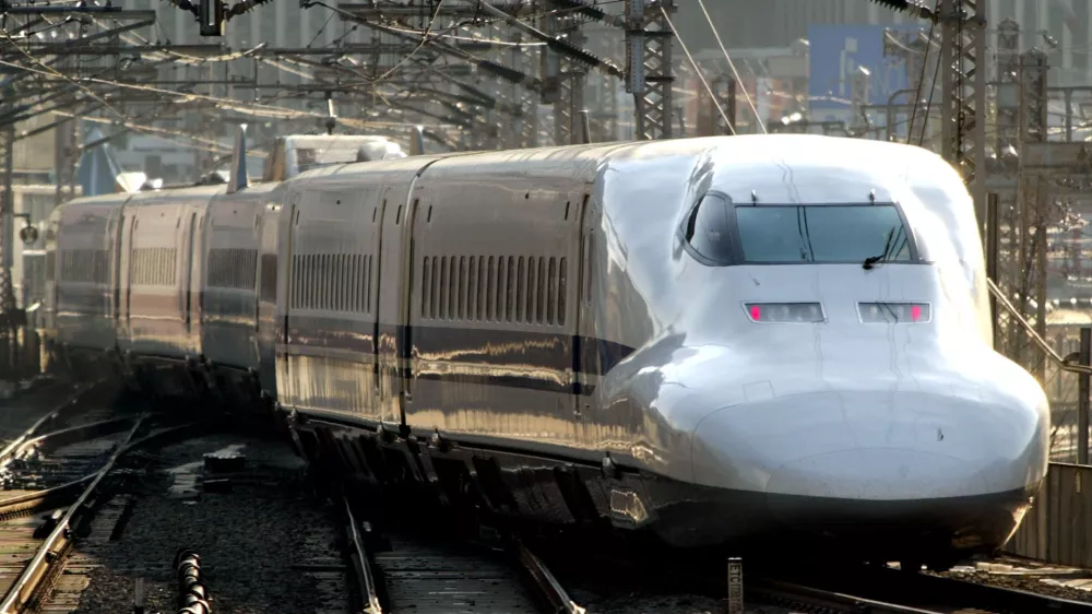 The latest type 700 of Japanese bullet train called "Shinkansen" leaves the Tokyo Railroad Station Monday, Dec. 30, 2002. Iron-wheeled "Shinkansen" with maximum speed of 350 kilometers per hour (220 mph) is the rival for Germany's magnetic levitation train which reaches 400 kilometers per hour (250 mph) in a race to receive Chinese order for its high-speed rail link between Beijing and Shanghai. German Chancellor Gerhard Schroeder will visit a maglev train project in Shanghai using German technology onTuesday for its promotion. (AP Photo/Itsuo Inouye)