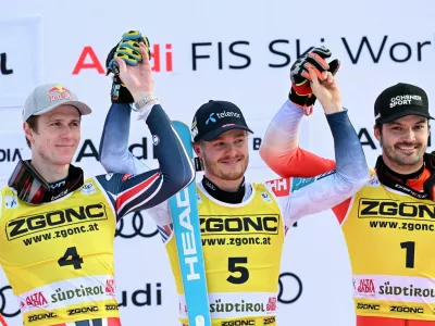 Alpine Skiing - FIS Alpine Ski World Cup - Men's Slalom - Alta Badia, Italy - December 22, 2025 Norway's Atle Lie McGrath celebrates during the medal ceremony after winning Men's Slalom along with second placed France's Clement Noel and third placed Switzerland's Loic Meillard REUTERS/Angelika Warmuth
