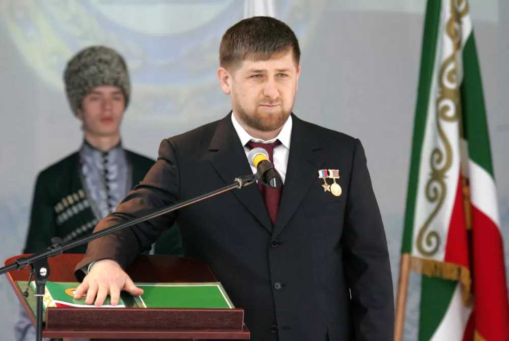 Ramzan Kadyrov swears upon the constitution during his inauguration as president in Gudermes April 5, 2007. Chechnya inaugurated on Thursday as its new president a 30-year-old amateur boxer praised by allies for restoring order to the troubled region and accused by rights groups of murdering and kidnapping civilians. REUTERS/Stringer