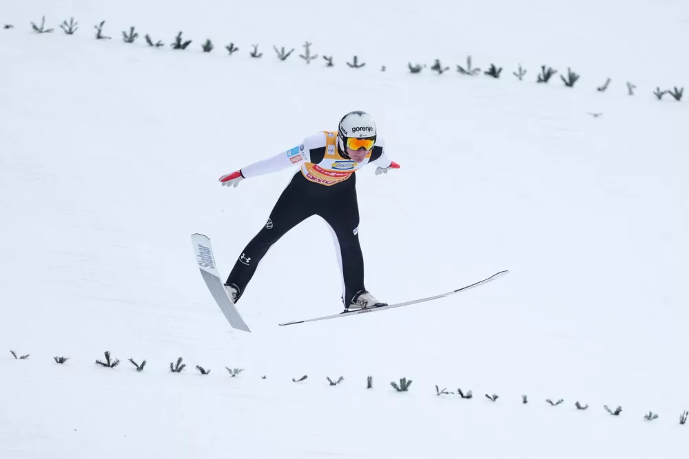 Domen Prevc, of Slovenia, soars through the air during his trial jump at the fourth stage of the Four Hills ski jumping tournament in Bischofshofen, Austria, Tuesday, Jan. 6, 2026. (AP Photo/Matthias Schrader)