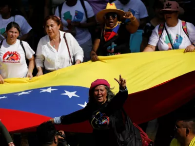 Government supporters participate in a women's march toward the office of interim President Delcy Rodriguez, days after the U.S. launched a strike on Venezuela and captured President Nicolas Maduro and his wife Cilia Flores, in Caracas, Venezuela, January 6, 2026. REUTERS/Leonardo Fernandez Viloria