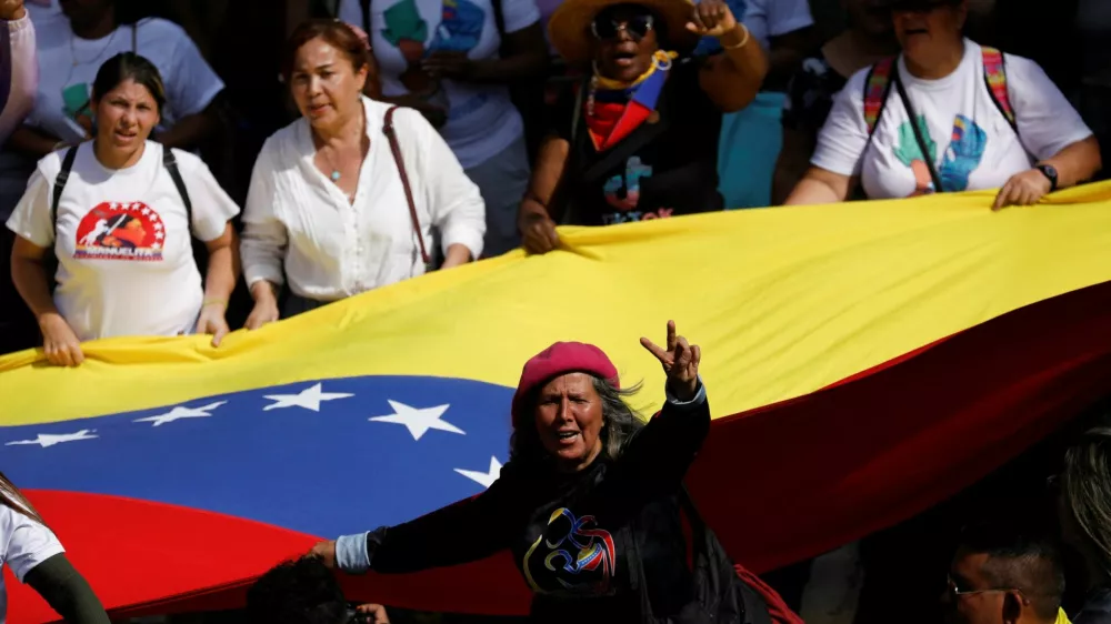 Government supporters participate in a women's march toward the office of interim President Delcy Rodriguez, days after the U.S. launched a strike on Venezuela and captured President Nicolas Maduro and his wife Cilia Flores, in Caracas, Venezuela, January 6, 2026. REUTERS/Leonardo Fernandez Viloria