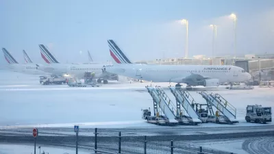 View of Air France planes on the snow-covered tarmac at the Paris CDG Terminal 2F of the Paris-Charles de Gaulle Airport, in Roissy-en-France, near Paris, as winter weather with snow and cold temperatures hits a part of the country, France, January 7, 2026. REUTERS/Abdul Saboor
