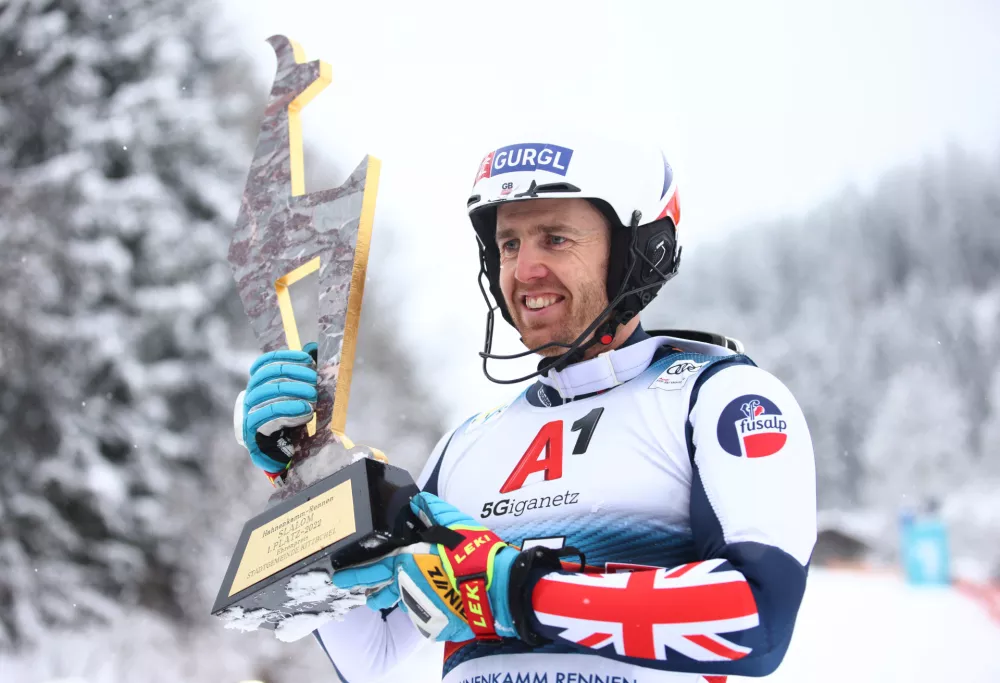 Alpine Skiing - FIS Alpine Ski World Cup - Men's Slalom - Kitzbuehel, Austria - January 22, 2022 Britain's Dave Ryding celebrates first place with trophy REUTERS/Lisi Niesner