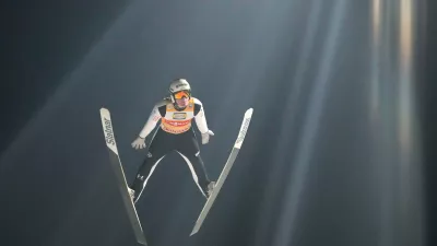 Domen Prevc, of Slovenia, soars through the air during his first round jump at the fourth stage of the Four Hills ski jumping tournament in Bischofshofen, Austria, Tuesday, Jan. 6, 2026. (AP Photo/Matthias Schrader)