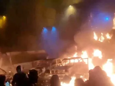FILE PHOTO: Protesters gather as vehicles burn, amid evolving anti-government unrest, in Tehran, Iran, in this screen grab obtained from a social media video released on January 9, 2026. Social Media/via REUTERS/File Photo