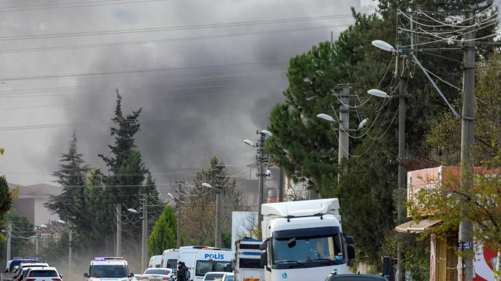 Smoke rises in the background as police block a road leading to a site where Turkish police launched an operation on a house believed to contain suspected Islamic State militants, and where, according to state media, seven officers were wounded in a clash, in Yalova province, Turkey, December 29, 2025. REUTERS/Umit Bektas   TPX IMAGES OF THE DAY