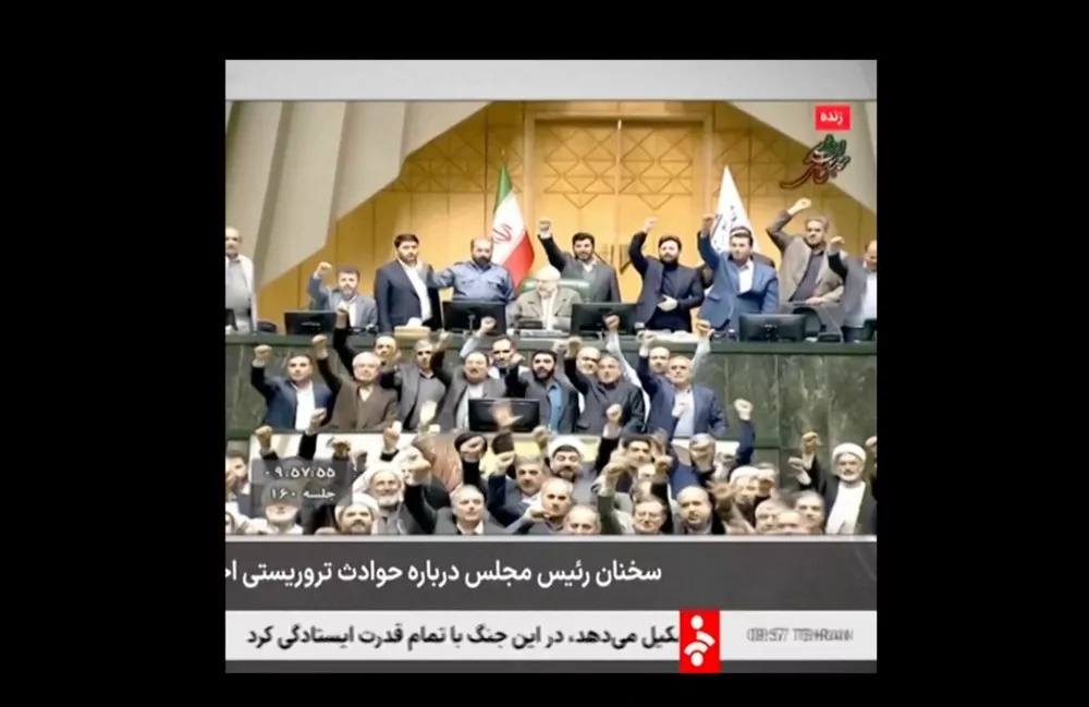 Members of Iran's Parliament chant and gesture around Parliament Speaker Mohammad Baqer Qalibaf as he speaks about Iran's response to possible U.S. attacks, in Tehran, Iran January 11, 2026, in this screengrab obtained from a video. IRINN/via Reuters TV/Handout via REUTERS  THIS IMAGE HAS BEEN SUPPLIED BY A THIRD PARTY. IRAN OUT. NO COMMERCIAL OR EDITORIAL SALES IN IRAN. NO USE IRAN, BBC PERSIAN. NO USE VOA PERSIAN. NO USE MANOTO. NO USE IRAN INTERNATIONAL. NO USE RADIO FARDA.