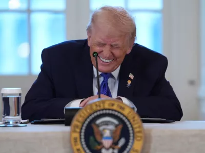 President Donald Trump smiles during a meeting with oil executives in the East Room of the White House, Friday, Jan. 9, 2026, in Washington. (AP Photo/Evan Vucci)