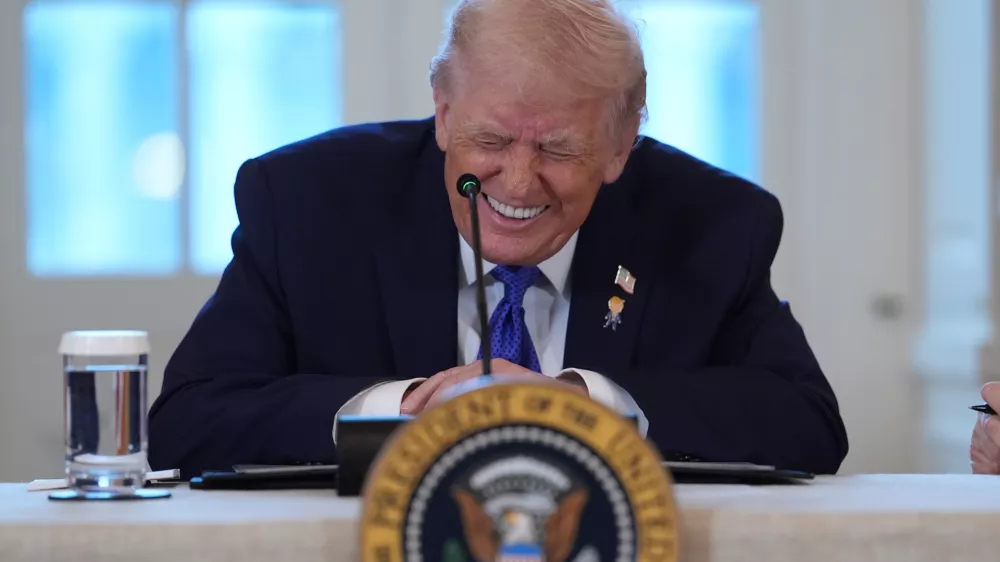 President Donald Trump smiles during a meeting with oil executives in the East Room of the White House, Friday, Jan. 9, 2026, in Washington. (AP Photo/Evan Vucci)