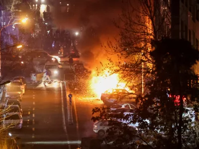Cars burn in a street during a protest over the collapse of the currency's value, in Tehran, Iran, January 8, 2026. Stringer/WANA (West Asia News Agency) via REUTERS ATTENTION EDITORS - THIS PICTURE WAS PROVIDED BY A THIRD PARTY   TPX IMAGES OF THE DAY