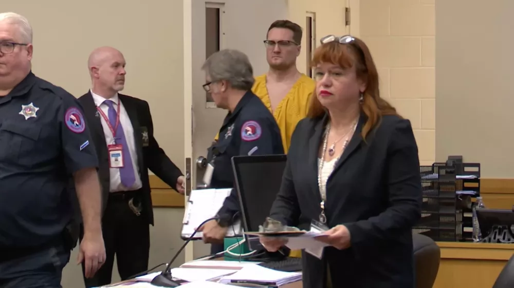 This image taken from video shows Michael David McKee walking into the courtroom on Monday, January 12, 2026, in Rockford, Ill. (WIFR News/Pool Photo via AP)