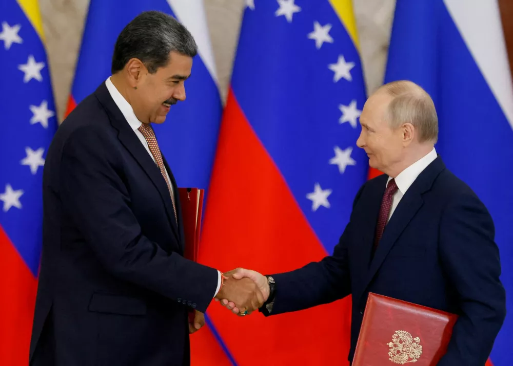 FILE PHOTO: Russian President Vladimir Putin shakes hands with Venezuelan President Nicolas Maduro during a signing ceremony following their talks at the Kremlin in Moscow, Russia, May 7, 2025. REUTERS/Maxim Shemetov/File Photo