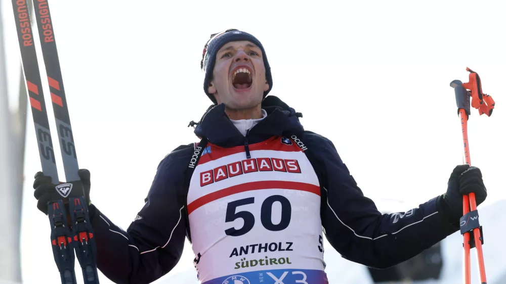 Third placed Tommaso Giacomel of Italy celebrates after a Biathlon men's World Cup 10km sprint race, in Anterselva, Italy, Friday Jan. 24, 2025. (AP Photo/Alessandro Trovati)
