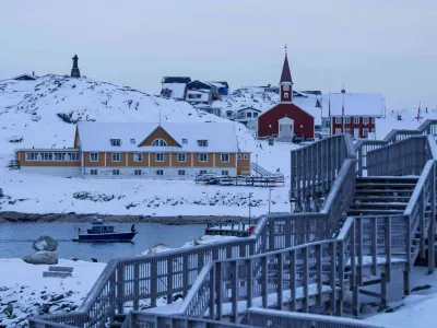 A boat travels at the sea inlet in Nuuk, Greenland, on Tuesday, Jan. 13, 2026. (AP Photo/Evgeniy Maloletka)