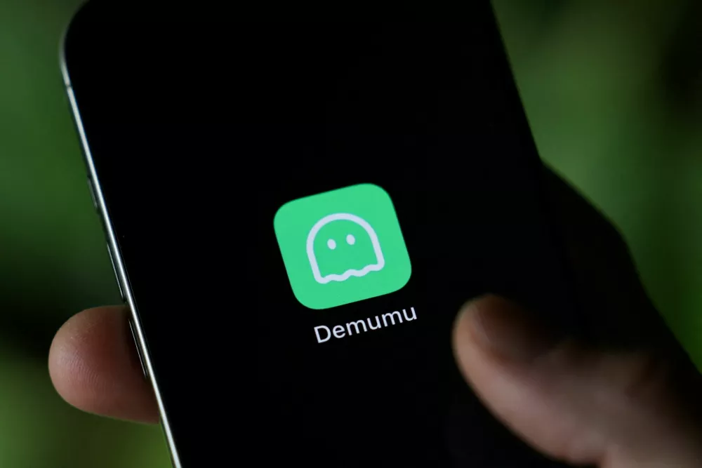 A logo of "Are you dead" app, or "Demumu" in its english version, a Chinese safety tool designed for people living alone, appears on a mobile phone in this illustration picture taken January 14, 2026. REUTERS/Tingshu Wang/Illustration