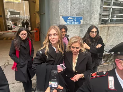 Influencer Chiara Ferragni, with her mother Marina Di Guardo, right, leaves the Milan Law Court on Wednesday, Jan. 14, 2026, after a first-instance acquittal in a trial in which she was indicted for promoting misleading advertising presented as charity. (AP Photo/Antonio Calanni)