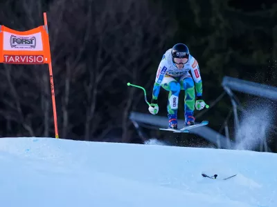 Slovenia's Ilka Stuhec speeds down the course during an alpine ski, women's World Cup downhill training, in Tarvisio, Italy, Friday Jan. 16, 2026. (AP Photo/Giovanni Auletta)