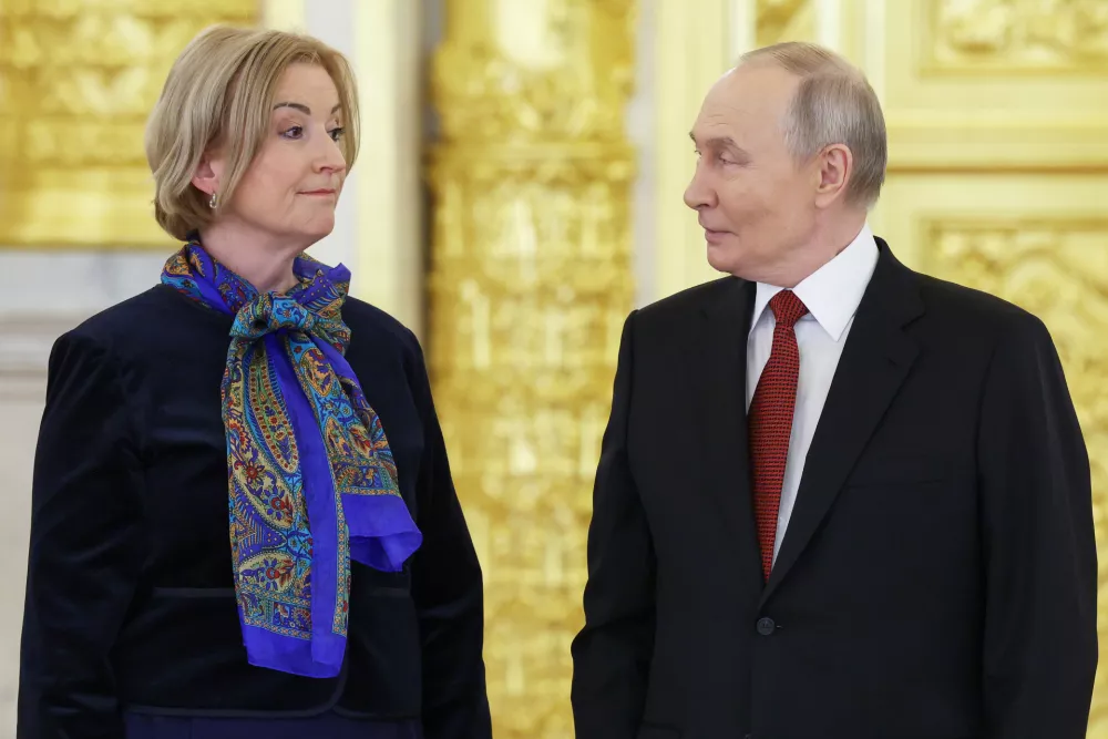 Russian President Vladimir Putin, right, and Sweden's Ambassador to Russia, Christina Johannesson, left, attend a ceremony to receive credentials from newly arrived ambassadors at the Alexander Hall of the Grand Kremlin Palace in Moscow, Russia, Thursday, Jan. 15, 2026. (Ramil Sitdikov/Pool Photo via AP)