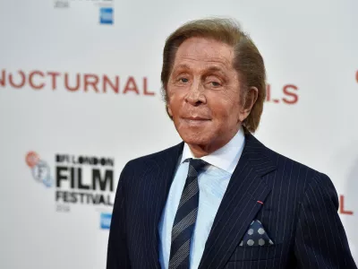 FILE PHOTO: Designer Valentino Garavani poses as he arrives for the gala screening of the film "Nocturnal Animals" during the 60th British Film Institute (BFI) London Film Festival at Leicester Square in London, Britain October 14, 2016. REUTERS/Hannah McKay/File Photo