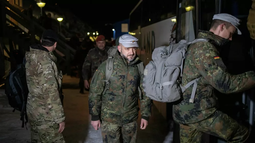 Soldiers from the German Armed Forces board a bus upon their arrival in Nuuk, Greenland, January 16, 2026. REUTERS/Marko Djurica