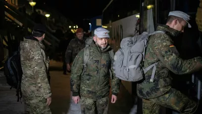 Soldiers from the German Armed Forces board a bus upon their arrival in Nuuk, Greenland, January 16, 2026. REUTERS/Marko Djurica
