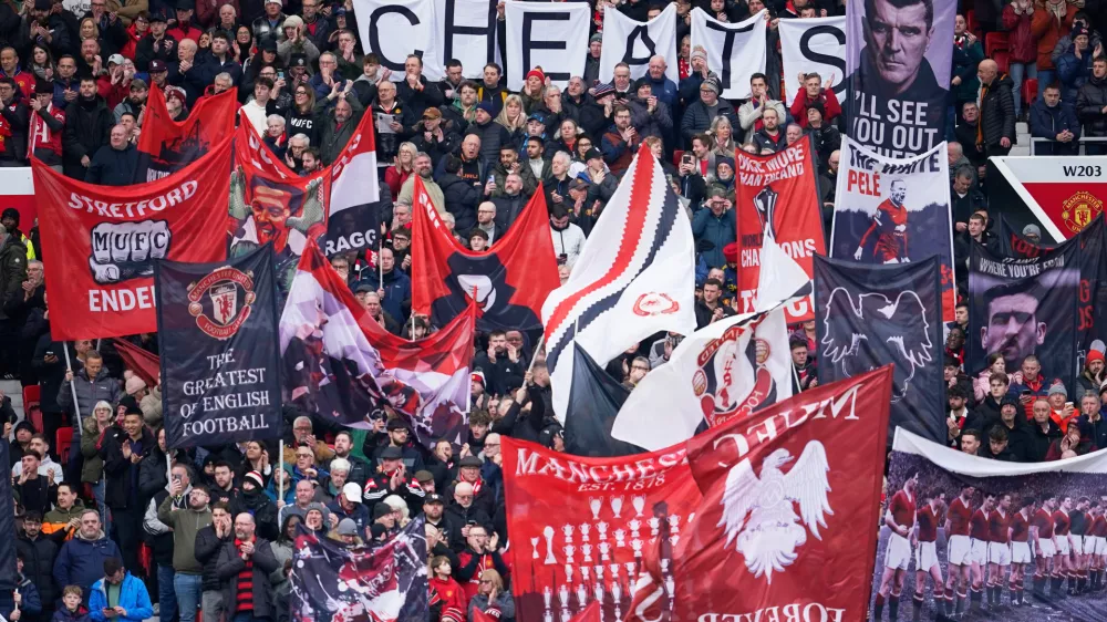 Manchester United fans cheer during the English Premier League soccer match between Manchester United and Manchester City in Manchester, England, Saturday, Jan. 17, 2026. (AP Photo/Dave Thompson)
