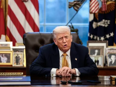 FILE PHOTO: U.S. President Donald Trump is interviewed by Reuters White House correspondent Steve Holland (not pictured) during an exclusive interview in the Oval Office in the White House in Washington, D.C., U.S., January 14, 2026. REUTERS/Evelyn Hockstein/File Photo