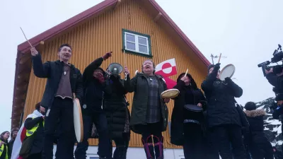 Inuits sing a national song during a protest against Trump's policy towards Greenland in front of the US consulate in Nuuk, Greenland, Saturday, Jan. 17, 2026. (AP Photo/Evgeniy Maloletka)