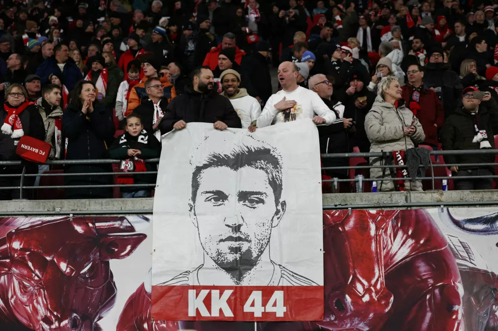 Soccer Football - Bundesliga - RB Leipzig v Bayern Munich - Red Bull Arena, Leipzig, Germany - January 17, 2026 RB Leipzig fans in the stands with a sign in tribute to Kevin Kampl REUTERS/Karina Hessland DFL REGULATIONS PROHIBIT ANY USE OF PHOTOGRAPHS AS IMAGE SEQUENCES AND/OR QUASI-VIDEO.