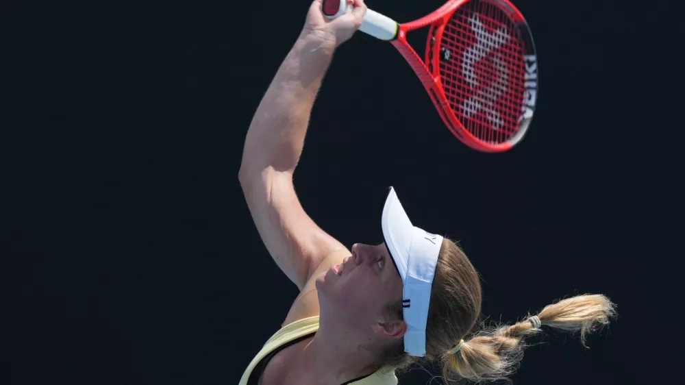 Veronika Erjavec of Slovenia serves to Magdalena Frech of Poland during their first round match at the Australian Open tennis championship in Melbourne, Australia, Monday, Jan. 19, 2026. (AP Photo/Dar Yasin)