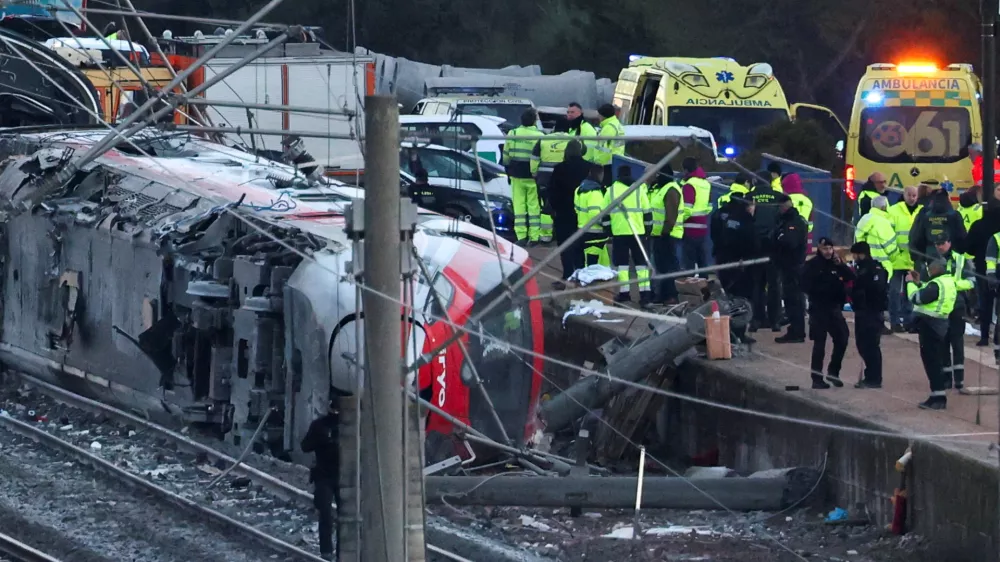 Members of the Spanish Civil Guard, along with other emergency personnel, work next to one of the trains&nbsp;involved in the accident, at the site of a deadly derailment of two high-speed trains near Adamuz, in Cordoba, Spain, January 19, 2026. REUTERS/Susana Vera