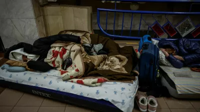 People sleep as they take shelter inside a metro station during a Russian missile and drone strike, amid Russia's attack on Ukraine, in Kyiv, Ukraine January 20, 2026. REUTERS/Alina Smutko