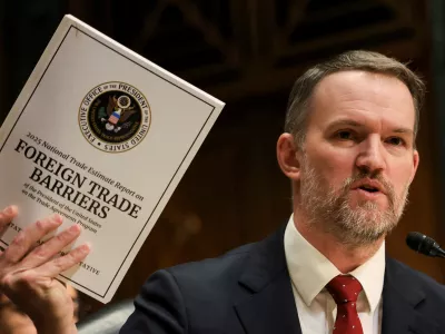 U.S. Trade Representative Jamieson Greer holds a copy of "Foreign Trade Barriers" as he testifies before a Senate Finance Committee hearing on U.S. President Donald Trump's trade policy, on Capitol Hill in Washington, D.C., U.S., April 8, 2025. REUTERS/Kevin Mohatt