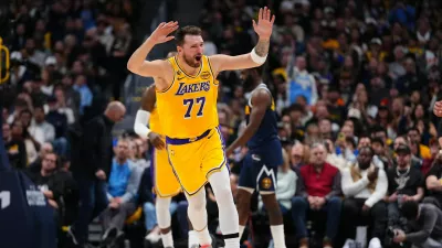 Los Angeles Lakers forward/guard Luka Dončić reacts during the second half of an NBA basketball game against the Denver Nuggets Tuesday, Jan. 20, 2026, in Denver. (AP Photo/Jack Dempsey)