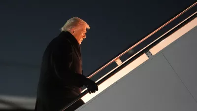 President Donald Trump boards Air Force One for a trip to attend the World Economic Form in Davos, Tuesday, Jan. 20, 2026, at Joint Base Andrews, Md. (AP Photo/Evan Vucci)