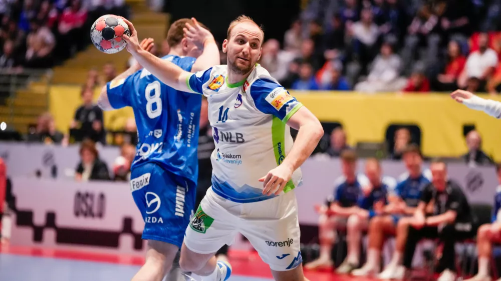 Slovenia's Domen Tajnik in action during the European Championship handball match between Slovenia and the Faroe Islands in Baerum, Norway Tuesday Jan. 20, 2026. (Erik Flaaris Johansen/NTB via AP)
