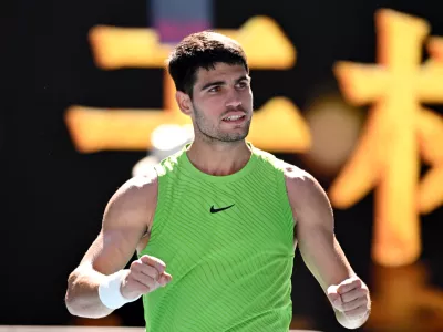 21 January 2026, Australia, Melbourne: Carlos Alcaraz of Spain celebrates match point during the Mens 2nd round match against Yannick Hanfmann of Germany on day 4 of the 2026 Australian Open tennis tournament at Melbourne Park in Melbourne. Photo: James Ross/AAP/dpa