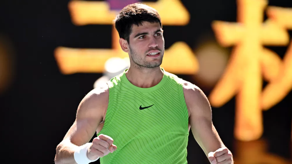 21 January 2026, Australia, Melbourne: Carlos Alcaraz of Spain celebrates match point during the Mens 2nd round match against Yannick Hanfmann of Germany on day 4 of the 2026 Australian Open tennis tournament at Melbourne Park in Melbourne. Photo: James Ross/AAP/dpa