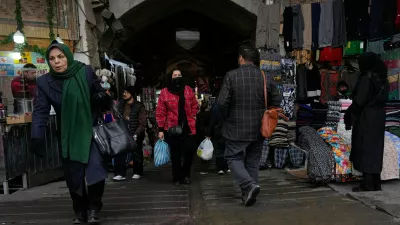 People walk at Tehran's historic Grand Bazaar, Tuesday, Jan. 20, 2026, in Iran. (AP Photo/Vahid Salemi)