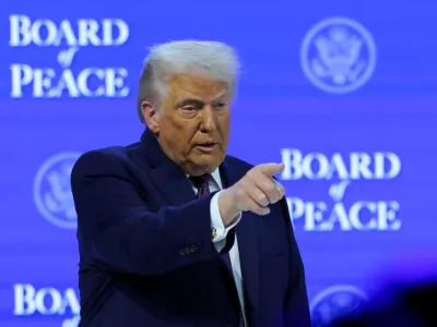 U.S. President Donald Trump takes part in a charter announcement for his Board of Peace initiative aimed at resolving global conflicts, alongside the 56th annual World Economic Forum (WEF), in Davos, Switzerland, January 22, 2026. REUTERS/Denis Balibouse