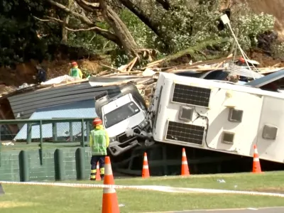 Damaged caravans and vehicles remain stuck amid rubble, in the aftermath of a landslide at a campsite triggered by heavy rains, in Mount Maunganui, New Zealand January 22, 2026.  TVNZ via REUTERS TV/Handout via REUTERS  THIS IMAGE HAS BEEN SUPPLIED BY A THIRD PARTY. NEW ZEALAND OUT. NO COMMERCIAL OR EDITORIAL SALES IN NEW ZEALAND. AUSTRALIA OUT. NO COMMERCIAL OR EDITORIAL SALES IN AUSTRALIA. No use New Zealand internet sites/any internet site of any New Zealand or Australia based media organisations or mobile platforms   TPX IMAGES OF THE DAY